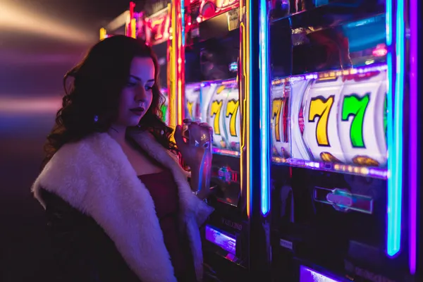 A player using their smartphone during a festive local event, representing MC888’s fully mobile-friendly casino.